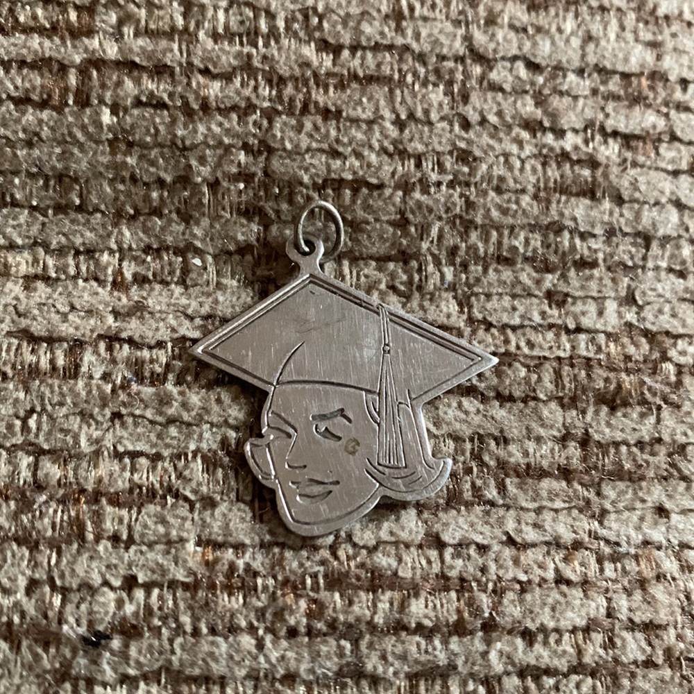 60’s vintage graduation young women head and cap marked ‘Sterling CT’